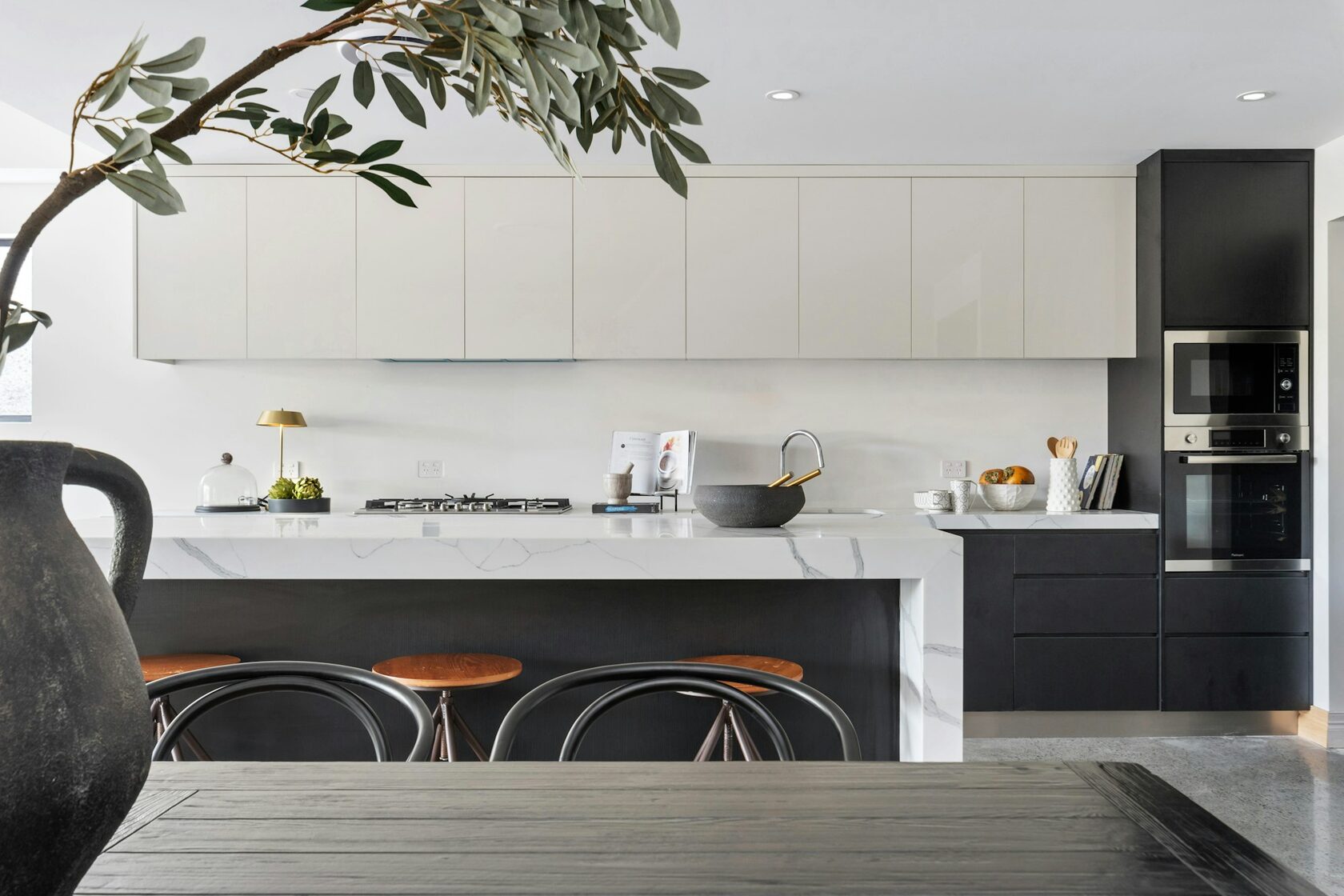 Modern Australian kitchen with island bench and warm natural finishes