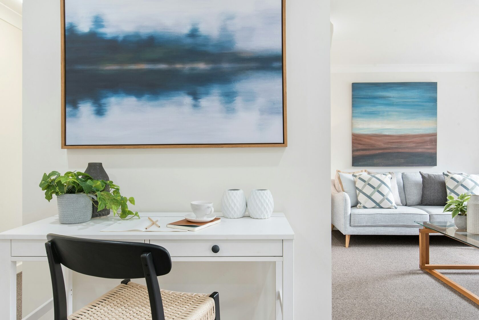 Contemporary open-plan living room with warm timber accents and abundant natural light